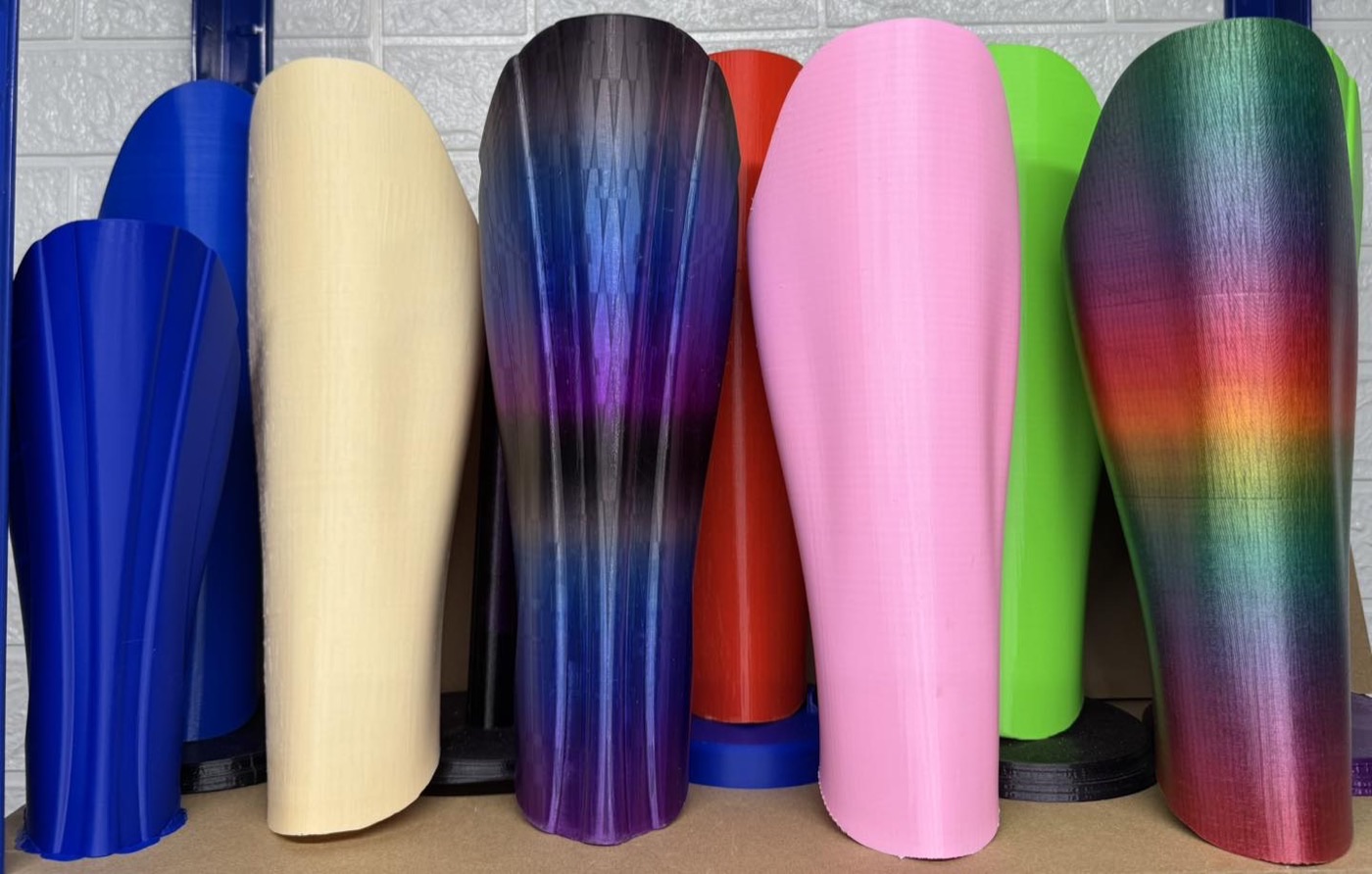 A row of StyleLimb covers in different colours on studio stands